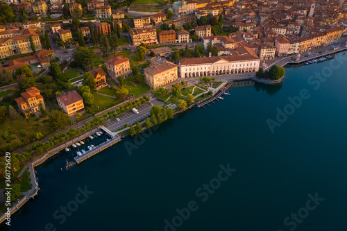 Aerial view of Lake Iseo at sunrise, on the left the city of lovere which runs along the lake,Bergamo Italy.