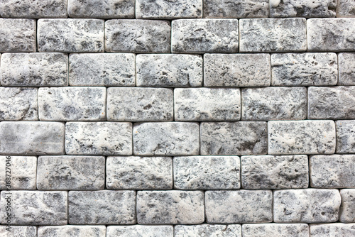 Seamless texture of white decorative stacked stone, natural stone cladding. brick background. close up. Background
