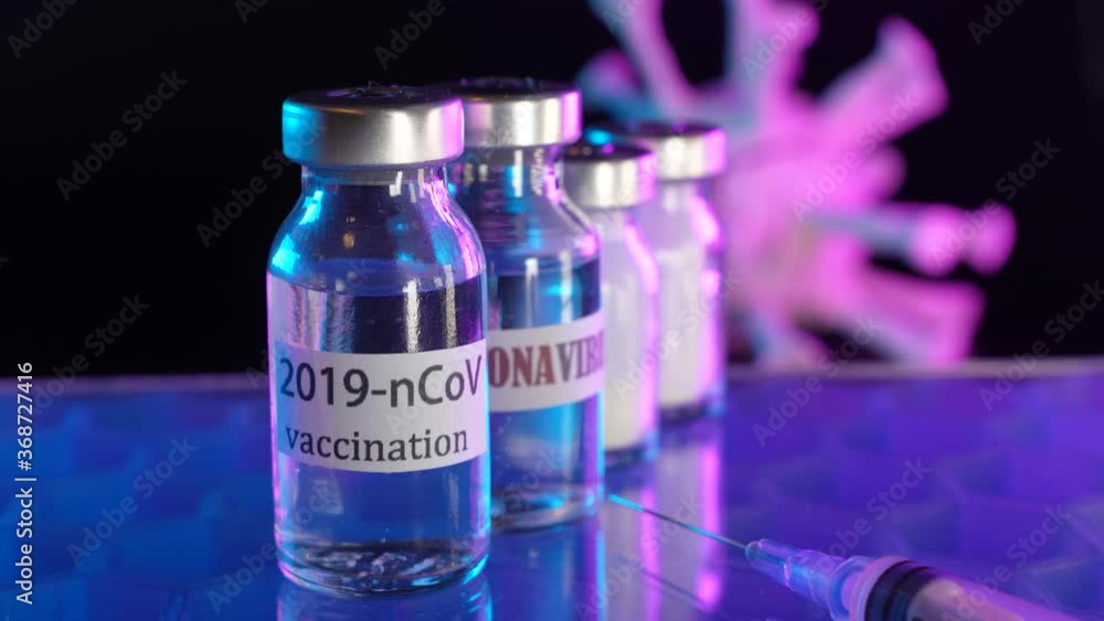 vaccine bottle with a label that Corona virus Vaccine injection,Healthcare And Medical concept. vaccine bottle with a label that Corona virus Vaccine injection,Healthcare And Medical concept.