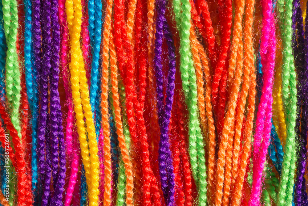 close up of colorful  thread wool fabric texture background vibrant colors yarn