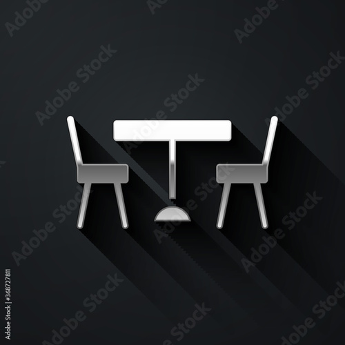Silver Picnic table with chairs on either side of the table icon isolated on black background. Long shadow style. Vector.