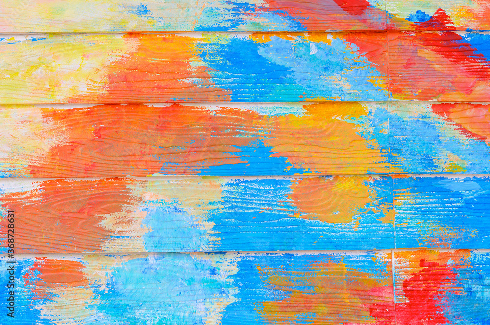 Abstract colorful paint on textured wooden wall,paint background