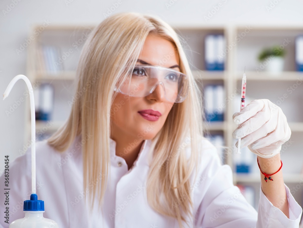 Young female woman doctor in hospital clinic lab Young female woman doctor in hospital clinic lab