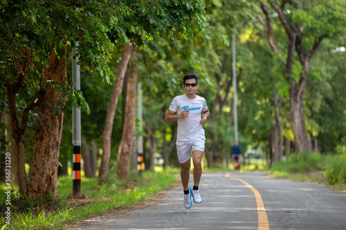 Asian men jogging and running in the park