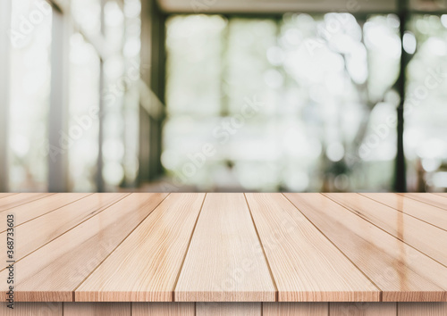 Empty wooden top table with on blur restaurant background