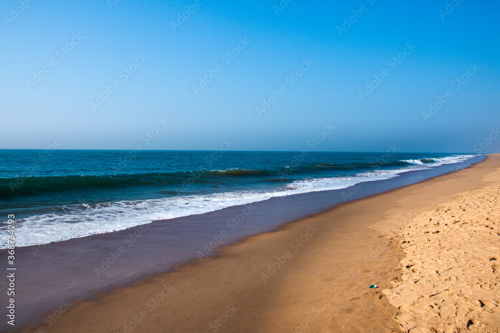 Beautiful Goa Sea beach and water waves at the time of Sunset.