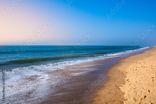 Fototapeta Naklejka Na Ścianę i Meble -  Beautiful Goa Sea beach and water waves at the time of Sunset.
