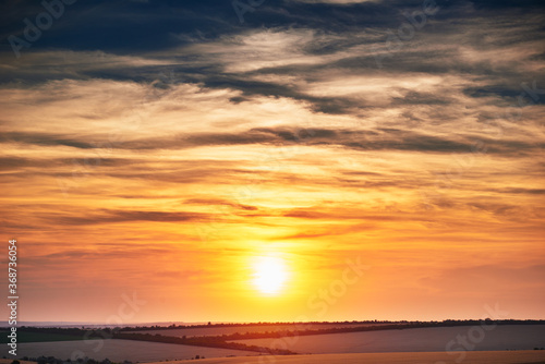 wheat field in a beautiful sunset, sunlight and clouds © soleg