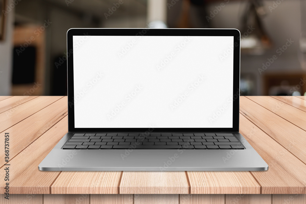 Laptop with blank screen on wooden table with bokeh restaurant backgound Laptop with blank screen on wooden table with bokeh restaurant backgound