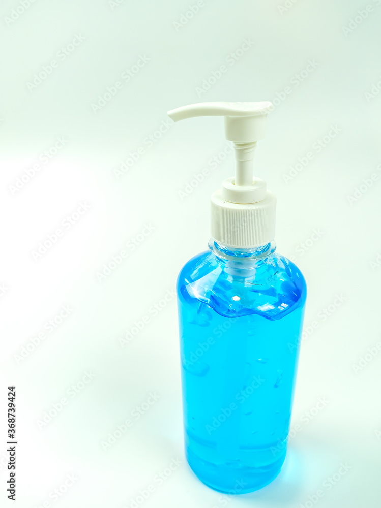 Alcohol gel bottles for hand washing. Disinfecting alcohol. Handwashing alcohol has a clear blue color on a white background. Alcohol gel bottles for hand washing. Disinfecting alcohol. Handwashing alcohol has a clear blue color on a white background.