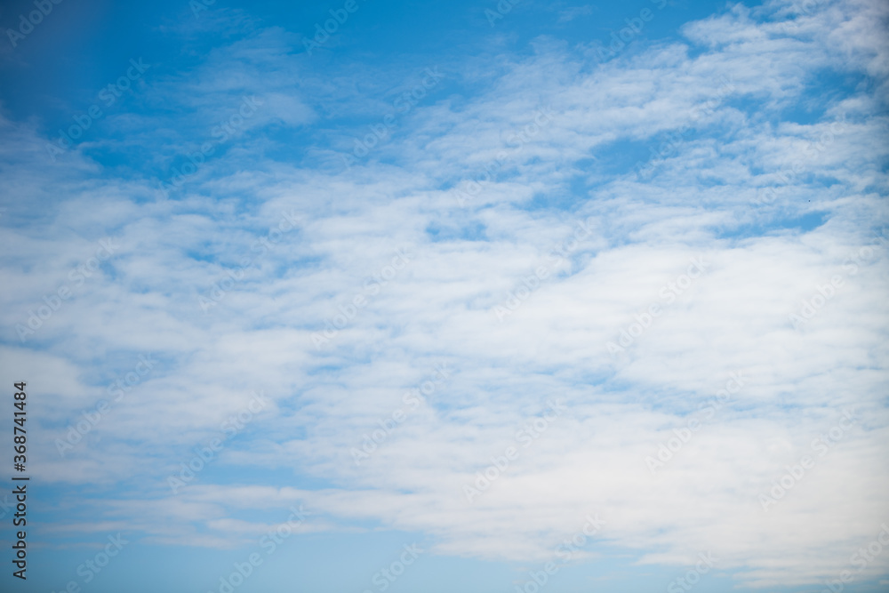 clear blue sky on a summer day with light cirrus clouds clear blue sky on a summer day with light cirrus clouds