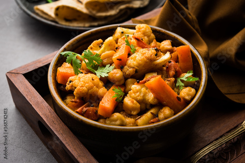 Indian Mix Veg or Mixed Vegetable recipe served in a bowl with chapati photo