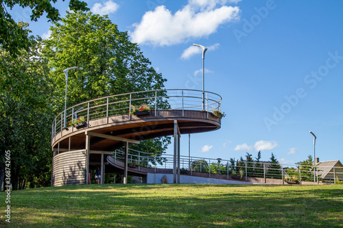 Park and walking paths in Moletai. Lakeside paths. Park benches. Bridges and piers by the lake. A place for walking and relaxing. Lakeside and beaches. Walks outside Architectural elements of the park photo