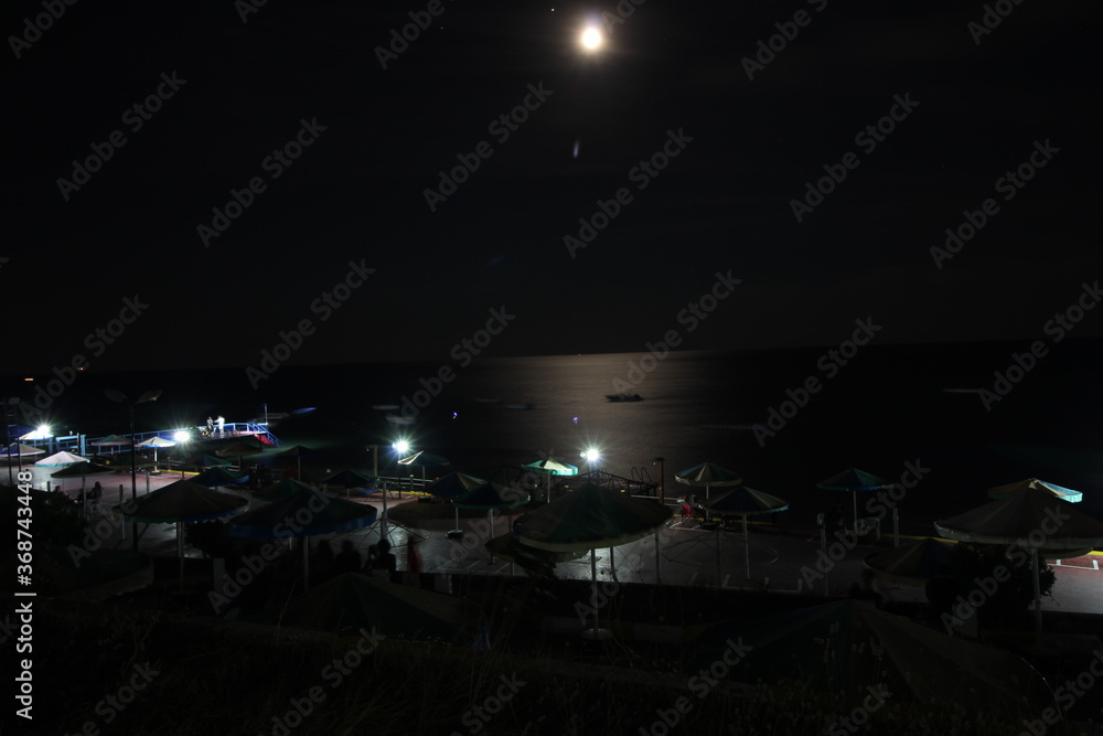 pier in the moonlight at night pier in the moonlight at night