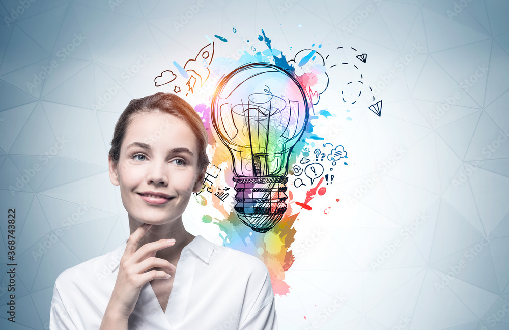 Cheerful young woman and her bright idea Cheerful young woman and her bright idea
