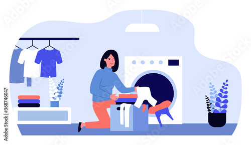 Woman doing laundry. Female character loading washing machine flat vector illustration. Laundromat, home appliance, housekeeping concept for banner, website design or landing web page