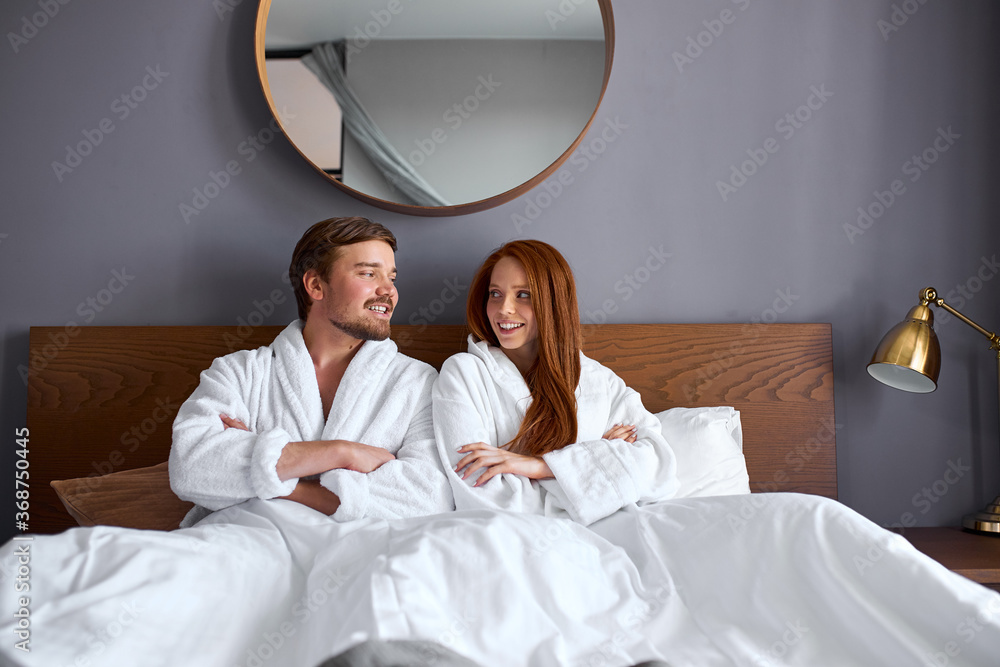 relaxed couple on bed, have leisure time. caucasian man and woman are in love, relaxed relaxed couple on bed, have leisure time. caucasian man and woman are in love, relaxed
