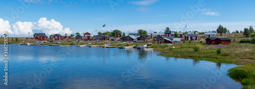 Traditional Fishing Village and Boat houses by the lake in Sweden on Stor-Rabben Island, Near Pitea in the Archipelago of Gulf of Bothnia in Northern Scandinavia.