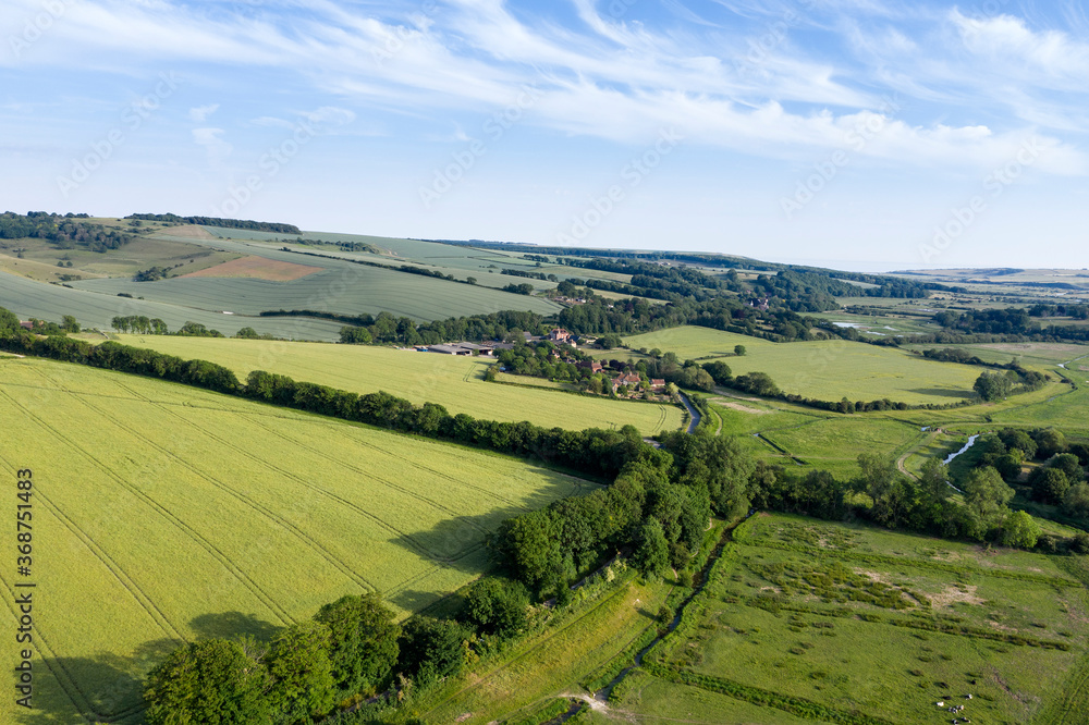 Beautiful drone landscape image over lush green Summer English countryside during late afternoon light Beautiful drone landscape image over lush green Summer English countryside during late afternoon light