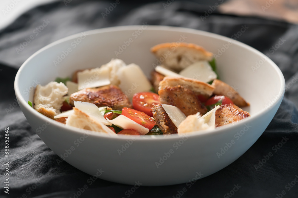 Fresh caesar salad with chicken and cherry tomatoes in white bowl Fresh caesar salad with chicken and cherry tomatoes in white bowl