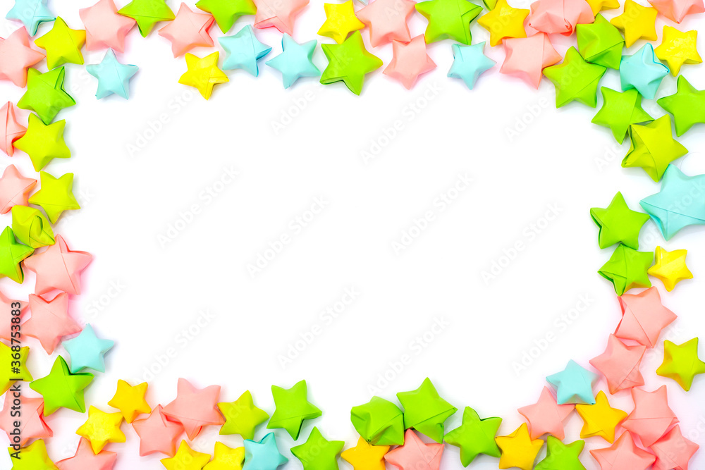 Frame of colorful paper stars in a children's style with an empty white place for text or image in the center Frame of colorful paper stars in a children's style with an empty white place for text or image in the center