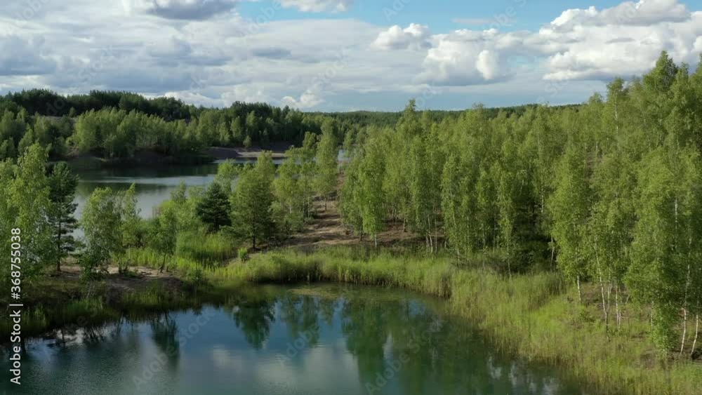 Flying over the lake in the abandoned clay quarry. Flying over the lake in the abandoned clay quarry.