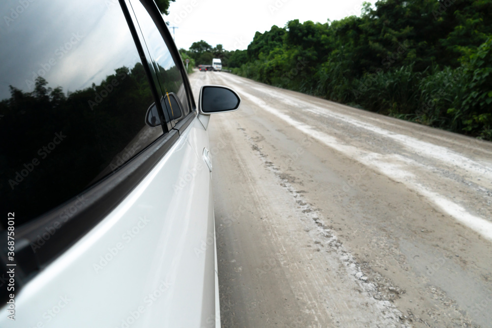 Beside of white car on the construction road. Open turn signal for safety,Traveling with nature. Beside of white car on the construction road. Open turn signal for safety,Traveling with nature.