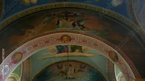 Artistic painting of the walls in the cathedral. Painted icons on the walls of the church.