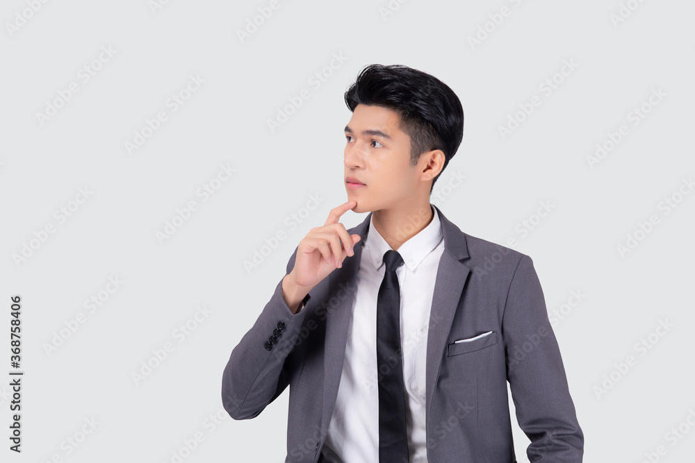 Portrait young asian business man in suit with smart thinking idea isolated on white background, businessman standing and planning for success, handsome manager or executive, emotion and expression. Portrait young asian business man in suit with smart thinking idea isolated on white background, businessman standing and planning for success, handsome manager or executive, emotion and expression.