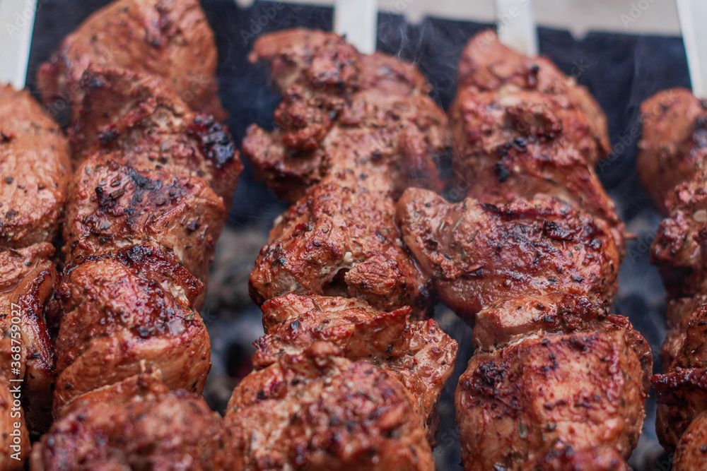 Delicious shish kebab is prepared on the grill Delicious shish kebab is prepared on the grill