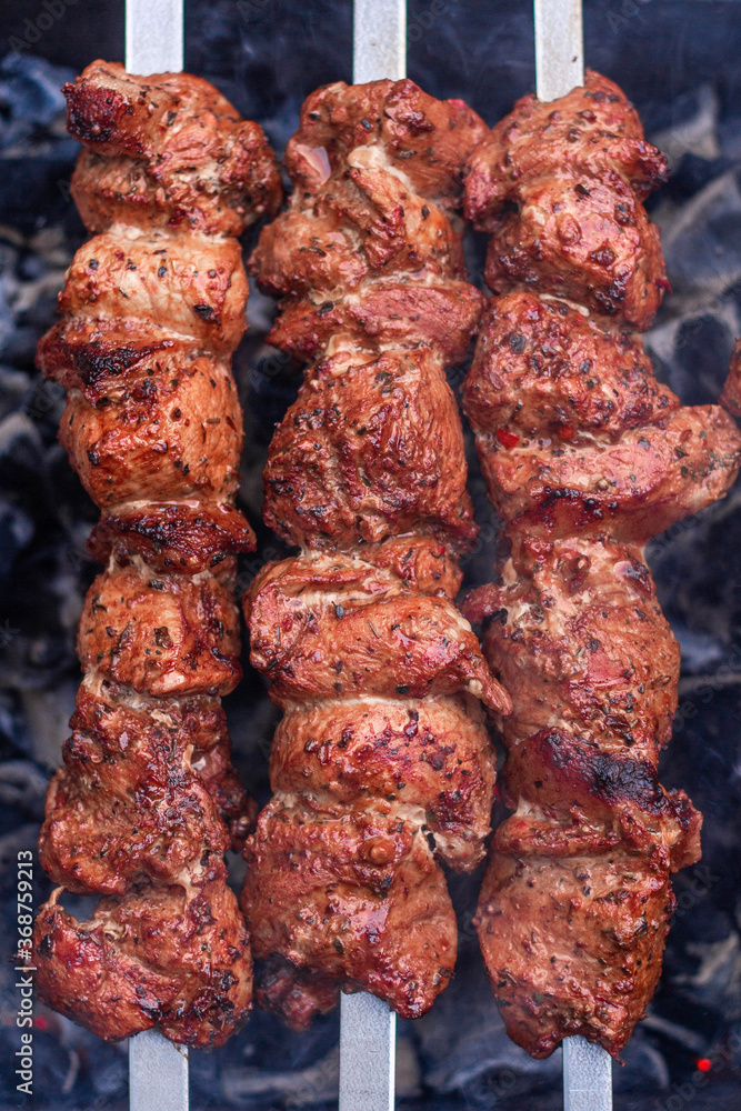 Delicious flavorful shish kebab is prepared on the grill