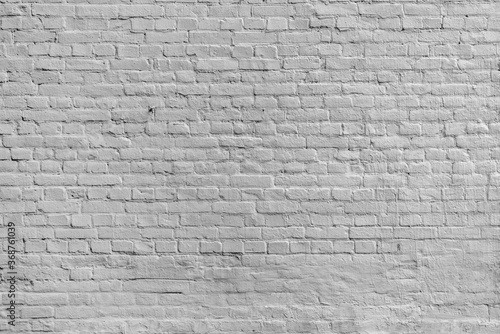 The background of the old black brick wall for design interior and  various scenes or as a background for video interviews.