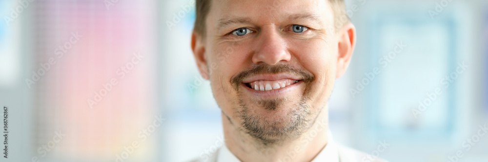 Caucasian adult smiling businessman office portrait. Business online education concept Caucasian adult smiling businessman office portrait. Business online education concept