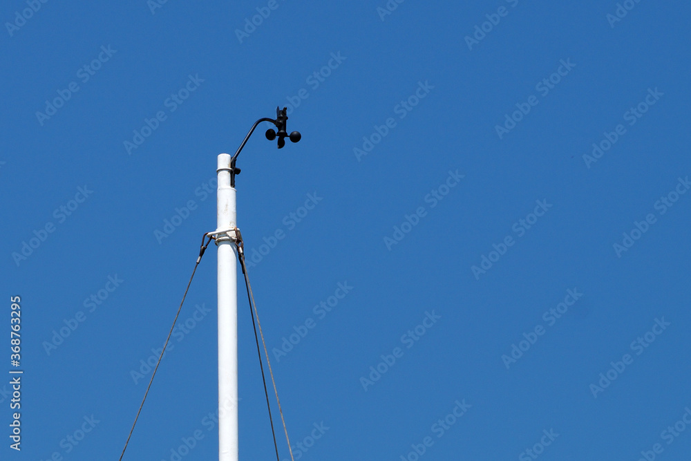 meteorological device for measuring wind speed against a blue sky meteorological device for measuring wind speed against a blue sky