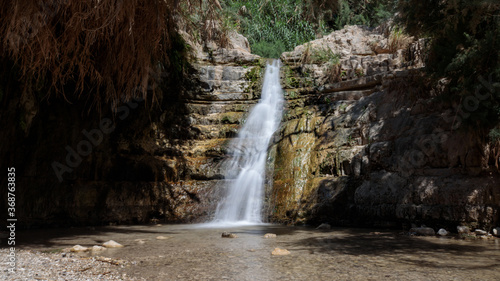 Waterfall in the desert – part of the Ein Gedi oasis natural reserve in southern Israel. Long exposure shot.