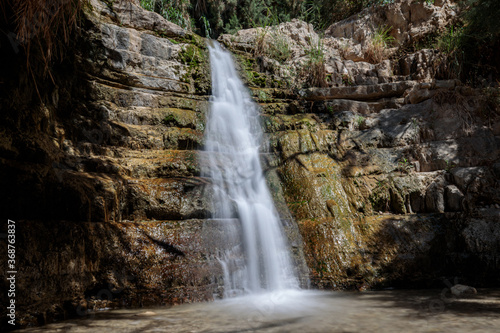 Waterfall in the desert – part of the Ein Gedi oasis natural reserve in southern Israel. Long exposure shot.
