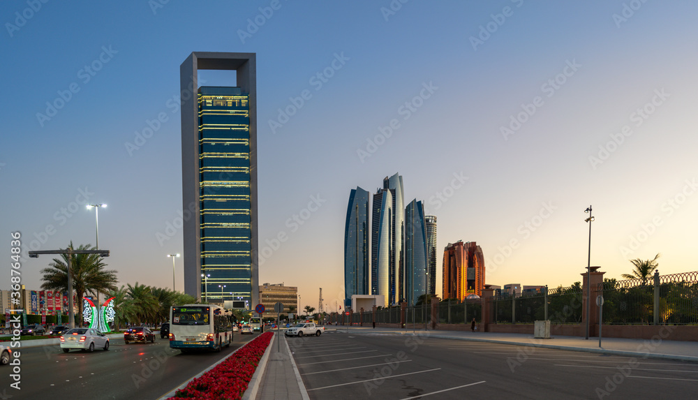 Beautiful city roads and towers at sunset | View of Abu Dhabi city Etihad towers and iconic landmarks at Corniche road