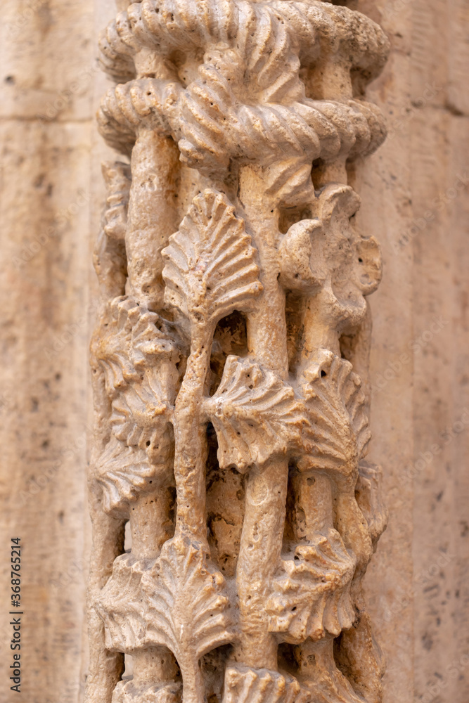 Floral bas-relief of an ancient gothic cathedral in Valencia Floral bas-relief of an ancient gothic cathedral in Valencia