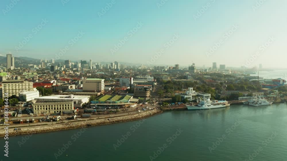 Panorama of Cebu City, seaport with ships and ferries and modern skyscrapers and residential buildings. Philippines. Panorama of Cebu City, seaport with ships and ferries and modern skyscrapers and residential buildings. Philippines.