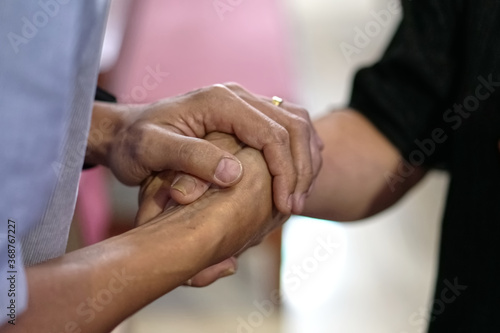 Couple holding hand, caring, praying