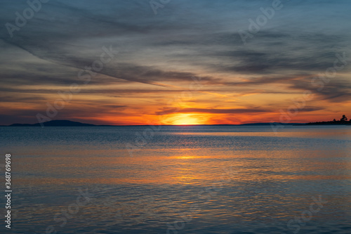 Croatia, island of Pag, beautiful dramatic sunset over Adriatic sea horizon, colorful red sky 