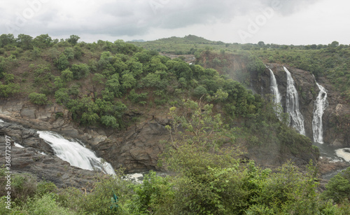 An Amazing view of the river Cauvery flowing majestically through Gaganachukki waterfall from a height of around 300 feet in Shivanasamudra town near Mysore in Karnataka state of India. photo