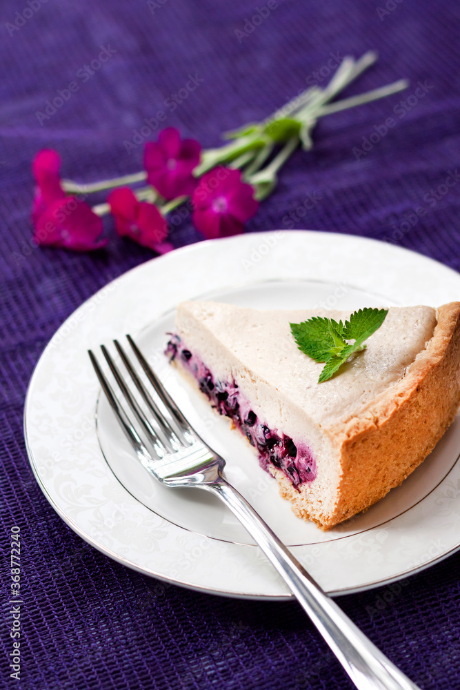 Slice of coffee cake with blueberries on a white plate Slice of coffee cake with blueberries on a white plate