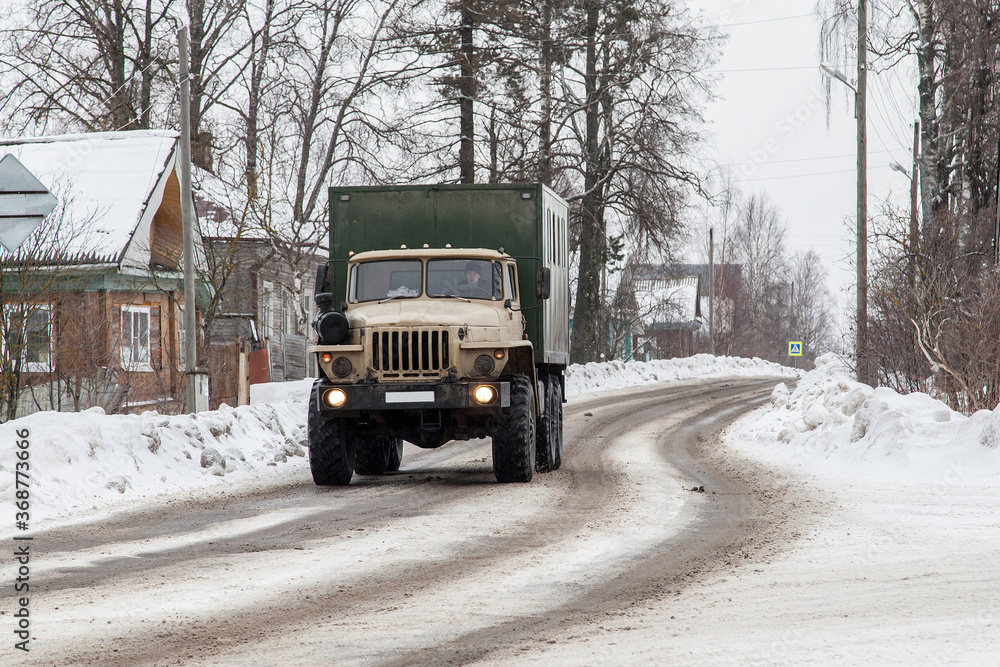 Russian heavy truck on the  snowy winter road