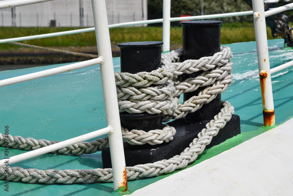 Fototapeta premium Heavy bolder with rop on board of a ship.