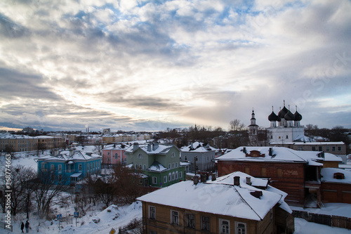 Winter ctyscape of small russian town with white orthodox church
