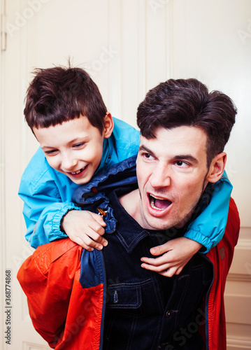 faher and son together having fun at home, lifestyle happy family, people at home photo