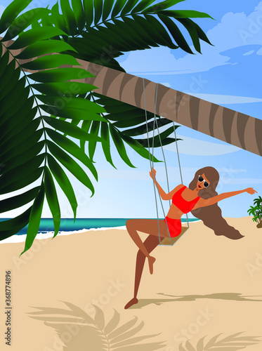 Girl on vacation on the beach swinging on a swing under a palm tree