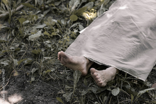 Canvas Print The human corpse is covered with a sheet