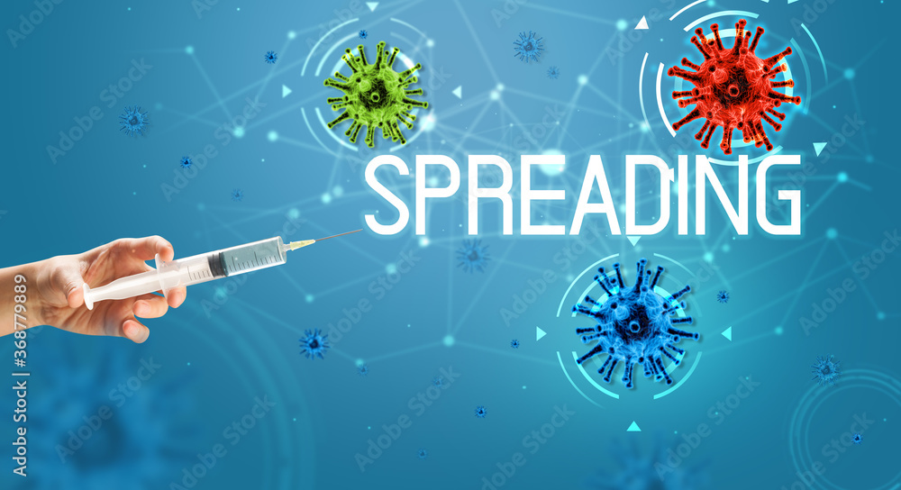 Syringe, medical injection in hand with SPREADING inscription, coronavirus vaccine concept Syringe, medical injection in hand with SPREADING inscription, coronavirus vaccine concept